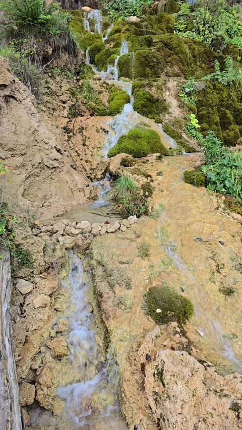 Relaxing slow motion video of clear water stream Stock Footage 318433675