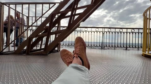 Relaxing with sneakers viewing Paris from Eiffel Tower 스톡 동영상 334188007