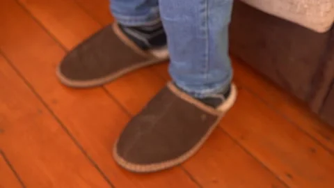Relaxing on the Sofa with Fluffy Slippers on Stock Footage 147447151