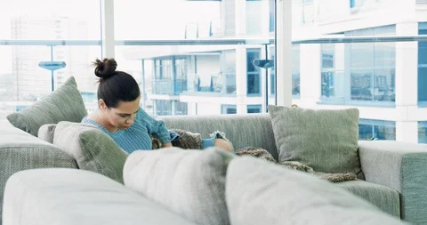 Relaxing on sofa Stock Footage 129761359