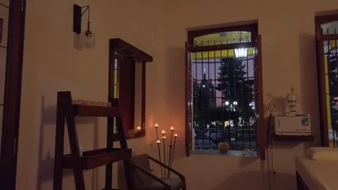 Relaxing spa massage room interior with a view of a city park at sunset Stock Footage 337463756