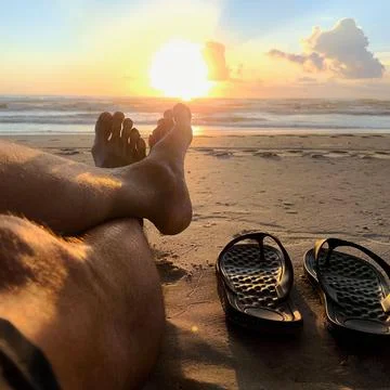 Relaxing sunset on the beach Stock Photos