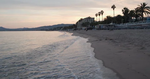 Relaxing sunset stroll along the tranquil beach of a coastal paradise with Stock-Footage 314076408