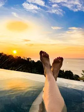 Relaxing Sunset View from an Infinity Pool Overlooking the Ocean Stock Photos