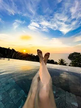 Relaxing Sunset View from an Infinity Pool Overlooking the Ocean Stock Photos
