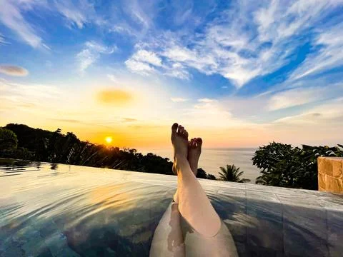Relaxing Sunset View from an Infinity Pool Overlooking the Ocean Stock Photos