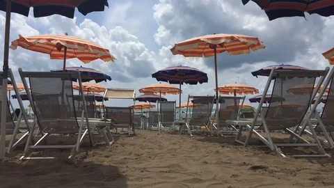 Relaxing under an umbrella - Timelapse Video stock 77460656