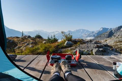 Relaxing view from the tent while camping in the mountains during the day. Stock Photos