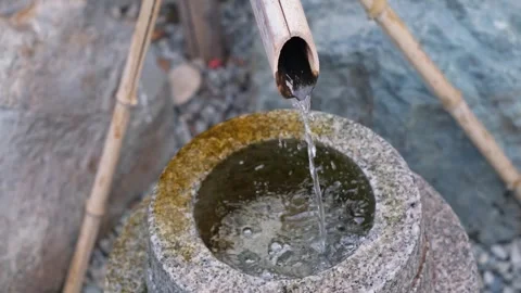 Relaxing water drop dripping from bamboo pipe close up 動画素材 340665859