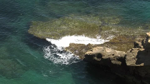 Relaxing Waves Breaking On Submerged Rock In Clear Tropical Waters 4K Stock Footage 108433265