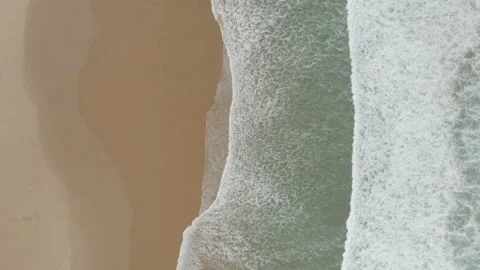 Relaxing waves on a continous long beach in Algarve, Portugal Stock Footage 220061843