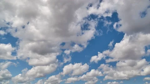 Relaxing White Clouds passing below blue sky in time lapse clip Stock Footage 131307063