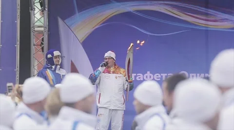 Relay race Olympic flame in Saint Petersburg in October. Torchbearer with flame Stock Footage 62745139