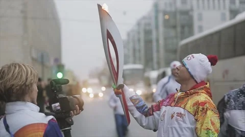 Relay race Olympic flame in Saint Petersburg. Torchbearer after run Stock Footage 62745189