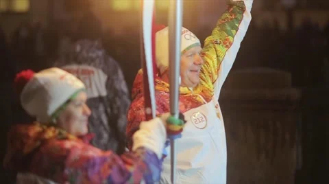 Relay race Olympic flame in Saint Petersburg in October. Male torchbearer pass Stock Footage 62745204