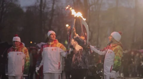 Relay race Olympic flame in Saint Petersburg in October. Torchbearer pass flame Stock Footage 62879287