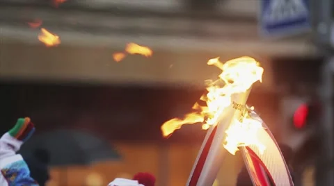 Relay race Sochi Olympic torch in Saint Petersburg. Two burning torch. Passing Stock Footage 62744245