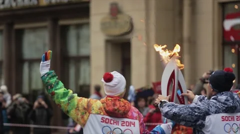 Relay race Sochi Olympic torch in Saint Petersburg. Back side torchbearer pass Stock Footage 62744675