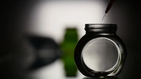 Release of red liquid from the syringe Stock Footage 125490641