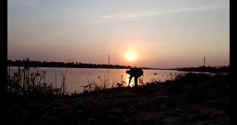 Release snails into the river Stock Footage 297725540