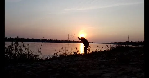 Release snails into the river Stock Footage 297725562
