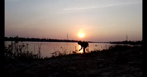 Release snails into the river Stock Footage 297725568
