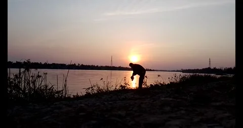 Release snails into the river Stock Footage 297725575