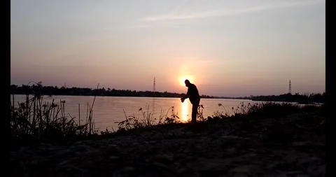 Release snails into the river Stock Footage 297725590