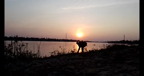 Release snails into the river Stock Footage 297725591