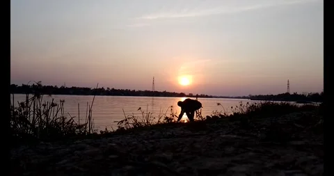 Release snails into the river Stock Footage 297725608