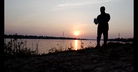 Release snails into the river Stock Footage 297725627
