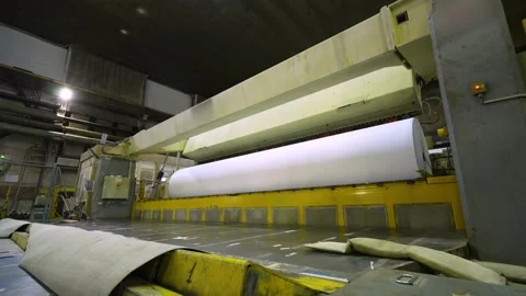 Release of white paper in rolls from a cutting machine. Paper production Stockbeeldmateriaal 302019072
