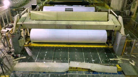 Release of white paper in rolls from a cutting machine. Paper production Stockbeeldmateriaal 302054532