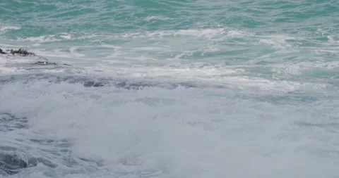 Relentless Ocean Swells on Jagged Rocks Video stock 330272982