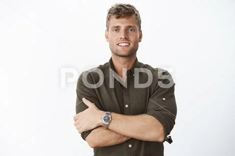 Reliable and confident boyfriend on guard. Charming blond man with blue eyes and Stock Photos