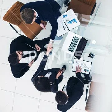 Reliable handshake business partners after the discussion of the financial Stock Photos
