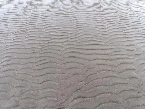 Relief on a sandy beach, full frame. Wavy pattern. Foto stock