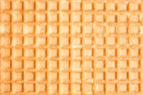 Relief texture of the surface of a cookie or favi, abstract background Stock Photos