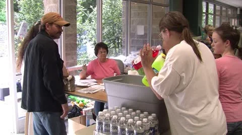 Relief workers helping flood victims Stock Footage 8960246