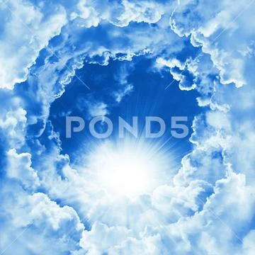 Religion of heavenly background. Divine shining heaven with dramatic clouds Stock Photos