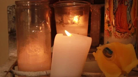 Religious candles lit on an altar inside the church Stock Footage 87038154