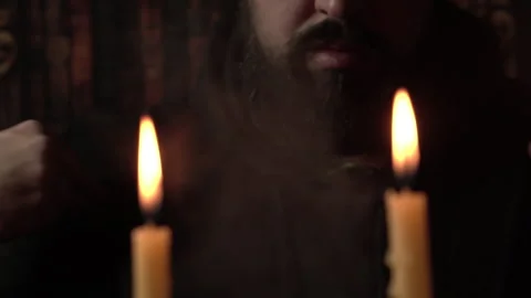 Religious Catholic Man Crossing Oneself and Praying in Front of Candles at Altar Stock Footage 331655061
