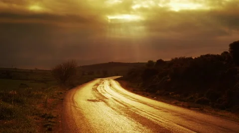 Religious concept sky opens up shines light rays illuminates path Stock Footage 48990238