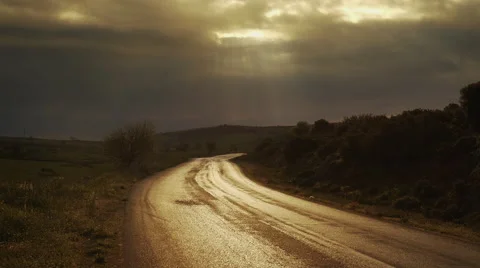 Religious concept sky opens up shines light rays illuminates path Stock Footage 48990361