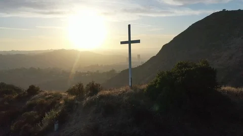 Religious Cross on a Mountaintop at Sunset Stock Footage 116737410