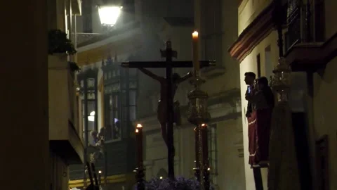 Religious Float Moving Through Narrow Street in Seville at Night Stock Footage 336015134