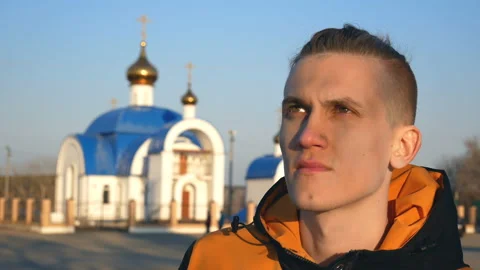 Religious guy looks into the distance. Stock Footage 122374500