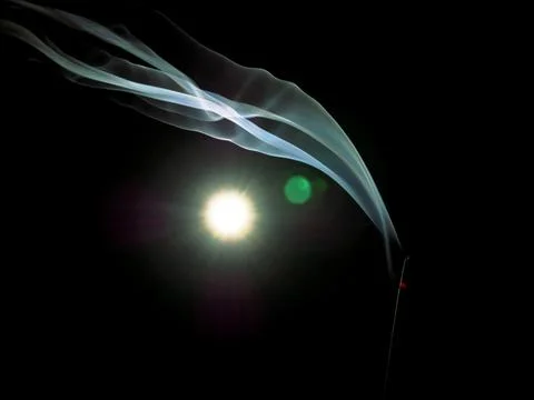 Religious holly stick fire smoke presented with light effect. Fotos de archivo