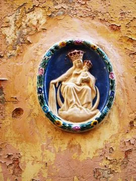 Religious icon stuck inside wall at Valetta Stock Photos