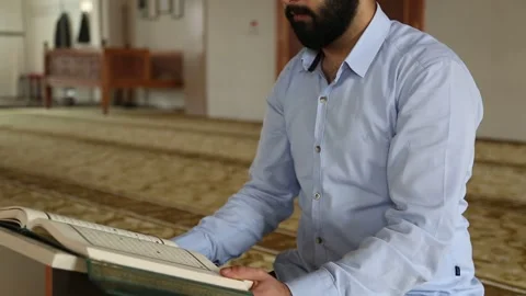 Religious Man Studying Holy Quran in Mosque Stock Footage 346473977